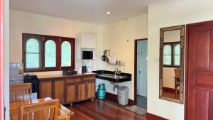 a kitchen with a sink and a counter top at The Hill Village in Thong Nai Pan Noi