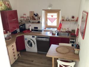 a kitchen with a sink and a washing machine at Alle Fucine in Mallare