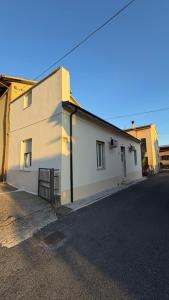 a white building on the side of a street at Le Case di Stela in Terni