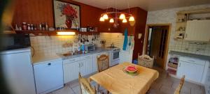a kitchen with a table with a bowl on it at Landgut Pinnow in Murchin