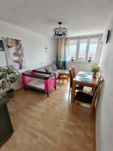 a living room with a couch and a table at Apartament WELES in Bolesławiec +41 photos