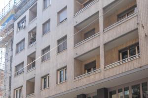 an apartment building with a man in the window at Borgo House, Bologna by Short Holidays in Bologna