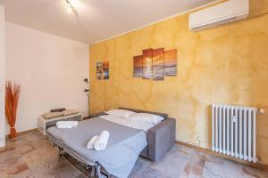a bedroom with a bed with two pillows on it at Borgo House, Bologna by Short Holidays in Bologna