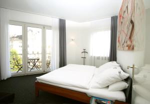 Postel nebo postele na pokoji v ubytování Chelsea Hotel
