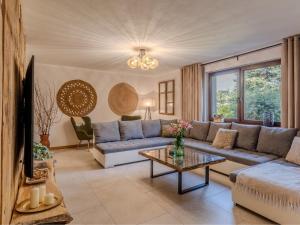 a living room with a couch and a table at OSNOWA Racławice in Racławice
