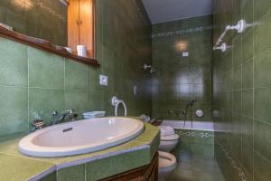 a bathroom with a sink and a toilet at Cantore, Cortina by Short Holidays in Cortina dʼAmpezzo +67 photos