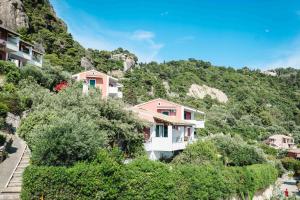 a house on the side of a mountain at Corfu Dream Holidays Villas in Glyfada
