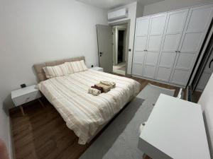 a bedroom with a bed with two towels on it at Liza Evren Sitesi in Manavgat