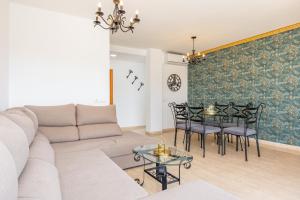 a living room with a couch and a table at Ferrera Soul 2a in Felanitx +19 photos