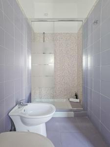 a bathroom with a toilet and a bath tub at Hotel Chrismare Taormina in Taormina +187 photos