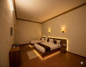 a bedroom with a large bed in a room at The Vanashva in Tehla