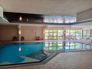 a large swimming pool in a hotel room with at Kurzentrum Ludwigstorff GmbH in Deutsch Altenburg