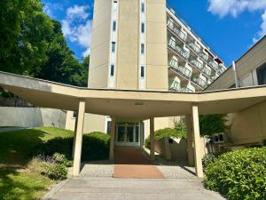 a building with a curved walkway in front of it at Kurzentrum Ludwigstorff GmbH in Deutsch Altenburg
