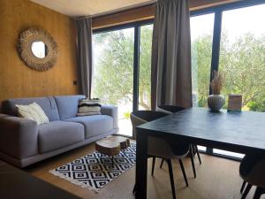 a living room with a couch and a table at Villa Beach Charly in Tisno