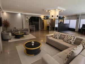 a large living room with a couch and a table at Çorlu Aras Hotel & City Center Location in Çorlu