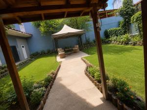 a garden with a gazebo and a lawn at Çorlu Aras Hotel & City Center Location in Çorlu