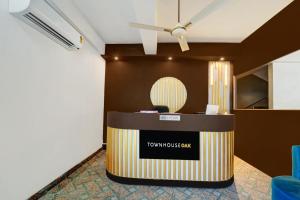 a lobby with a reception desk in a room at Super Hotel O The Dev Regency in Patna