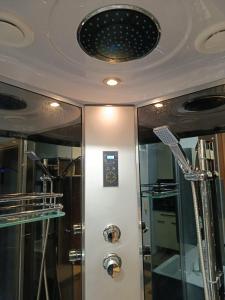 a bathroom with a shower and a ceiling at Apartmán Comfort in Trenčín