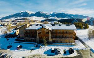 an aerial view of a building in the snow at Nature Appartements Font Romeu in Font-Romeu