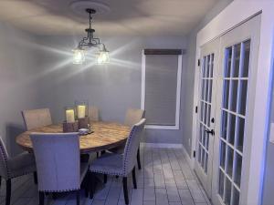 a dining room with a wooden table and chairs at Peaceful in Evergreen
