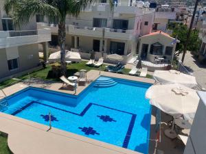 an overhead view of a swimming pool in a building at Sirena Apartments in Agia Pelagia