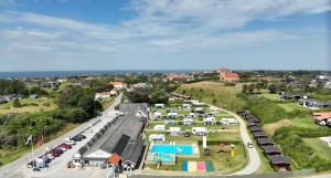 an aerial view of a parking lot with a pool at Lønstrup Egelunds Motel in Lønstrup