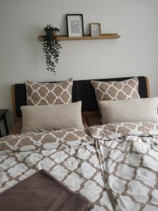 a bedroom with a bed with two pillows at Auszeit Sauerland in Schmallenberg