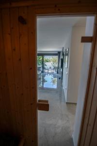 an open door to a room with a hallway at Vila Dominus Lux in Veliko Gradište