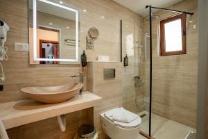 a bathroom with a sink and a glass shower at Hotel Dva Bisera in Ohrid +48 photos