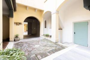 a hallway of a building with a door and plants at Nel Cuore di Bologna M ,Bologna by Shortholidays in Bologna