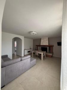a living room with a couch and a table at Oasi Lake Iseo in Solto Collina