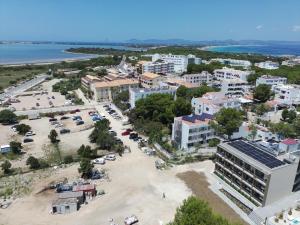 an aerial view of a city with a parking lot at Apartamentos Can Pitet in Es Pujols