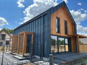 a house under construction with the front of it at Sun House z balią in Boszkowo-Letnisko