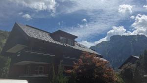 a house with a view of a mountain at Mellau Appartments 220 in Mellau