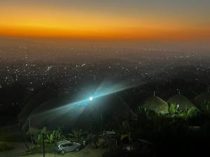 a night view of a city with a street light at Belema Resort & Spa in Jemo
