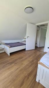 a bedroom with a bed and a closet at Officium P49 in Rakamaz