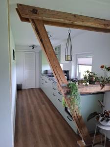 a kitchen with a wooden counter top in a room at Ferienwohnung Nordseewind in Aventoft