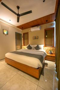 a bedroom with a large bed in a room at Leal Resort-Wayanad in Meppādi +21 photos
