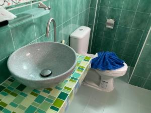 a bathroom with a sink and a toilet at Smile Home in Patong Beach +108 photos