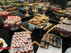 a display case filled with different types of desserts at Afyon Grand Arı Hotel in Afyon