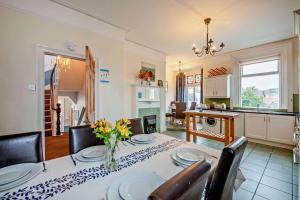 a kitchen and dining room with a table and chairs at 5 Bed in Tynemouth oc-cn125 in Tynemouth
