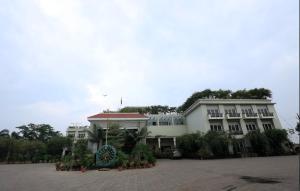 a building with a lot of plants in front of it at Surya Garden in Tālcher