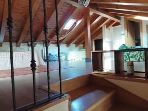 a room with a bed and wooden ceilings at La Casa deMercadillo in Liérganes