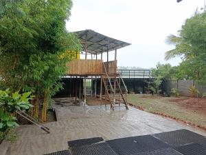 a building being constructed with a wooden scaffolding at White House KMCT in Kapūrwāhāl