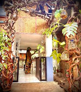 a person standing in the doorway of a building at Ohana in Coron