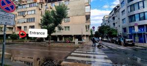 a group of people crossing a street in a city at City Centre Room Near Everything in Varna City