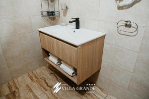 a bathroom with a sink and a shower at Villa Grande Terrace Jacuzzi Suite in Bugojno