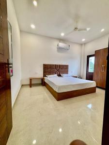 a bedroom with a large bed in a room at Hotel Channo Residency in Nadāmpur