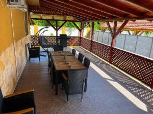 a patio with a table and chairs on a building at 21 Star Residence in Darnózseli