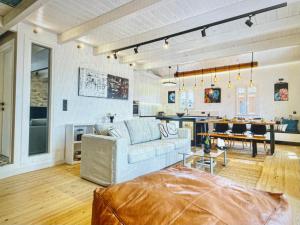a living room with a couch and a kitchen at Amazing apartment with view in Kanoni